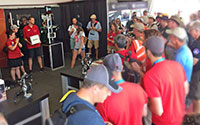 A crowd gathers for a drawing in the tent at AirVenture 2018