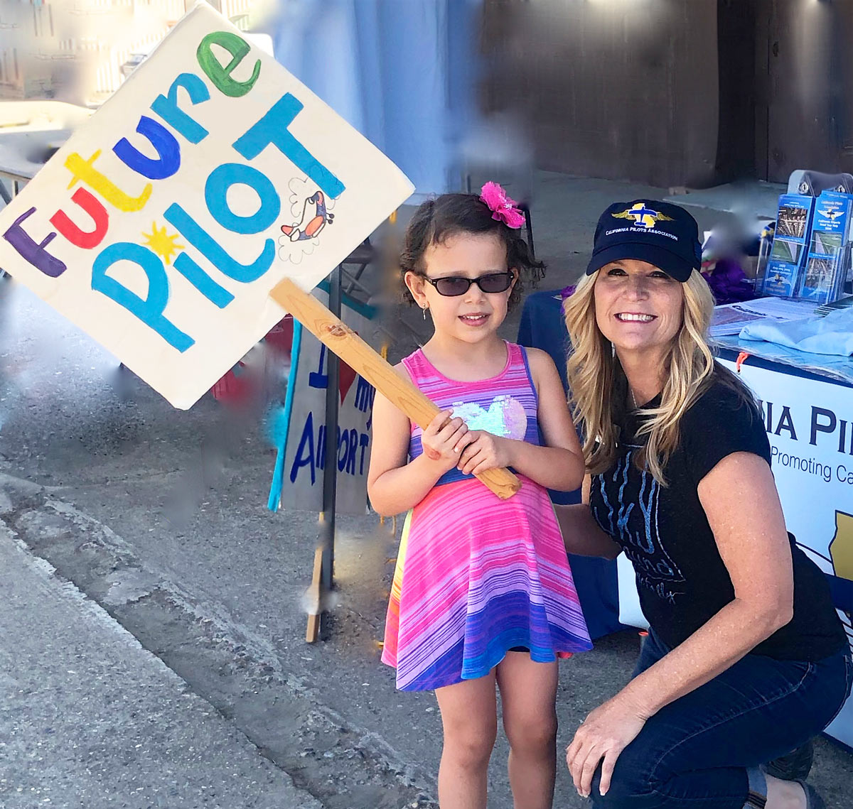 Future pilot girl with sign